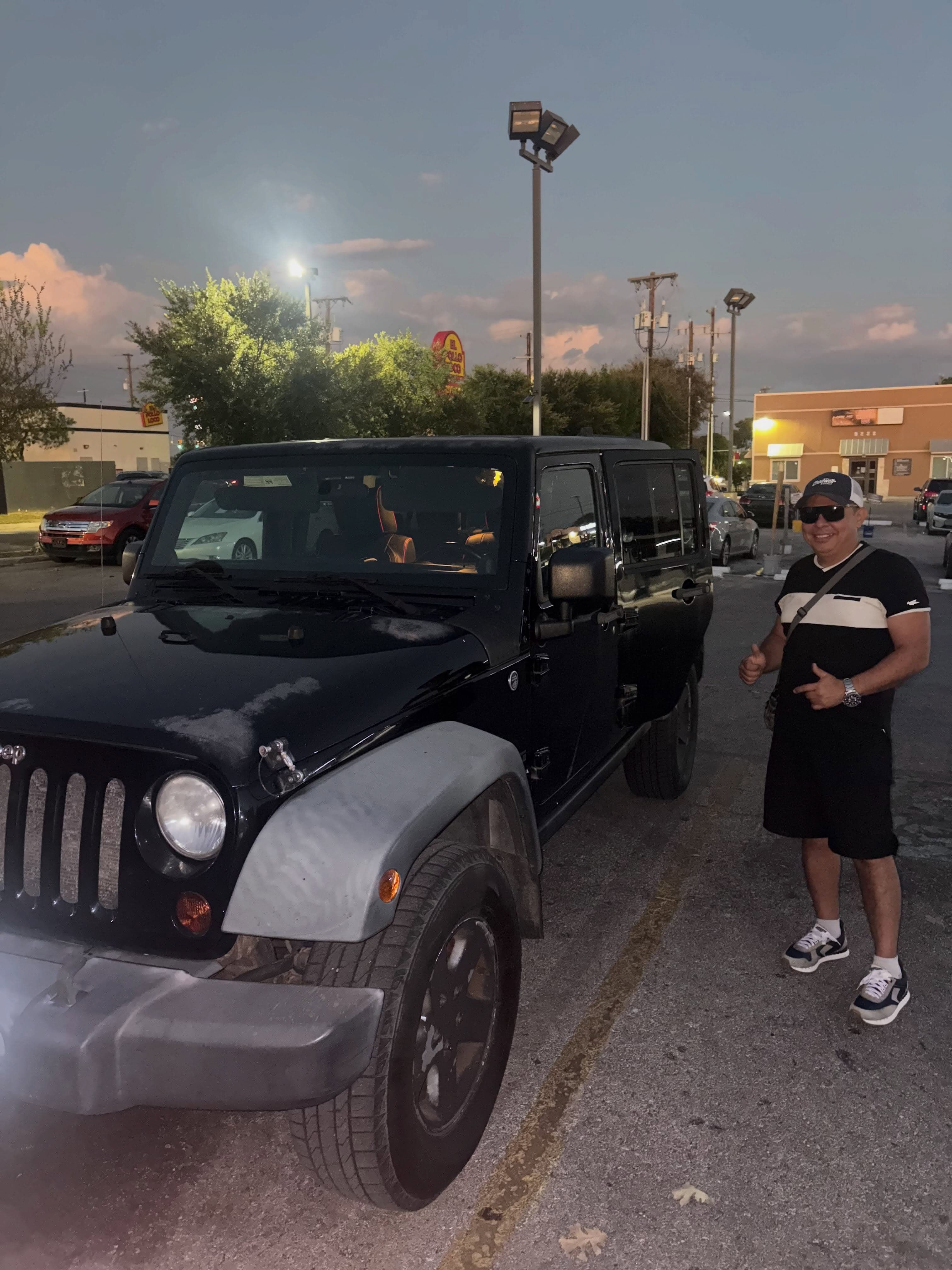 Handing over the keys to a clean Jeep Wrangler Unlimited.